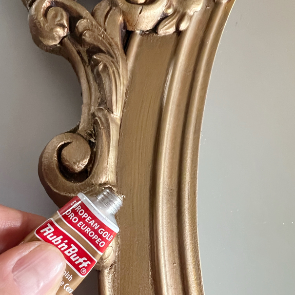 Vintage gold mirror and European Gold Rub'-N-Buff wax paste tube used for Rub'-N-Buff Mirror Makeover