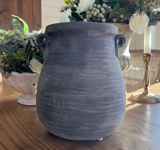 Black teardrop shaped pottery with lines of texture and a chalky finish. DIY vintage pottery