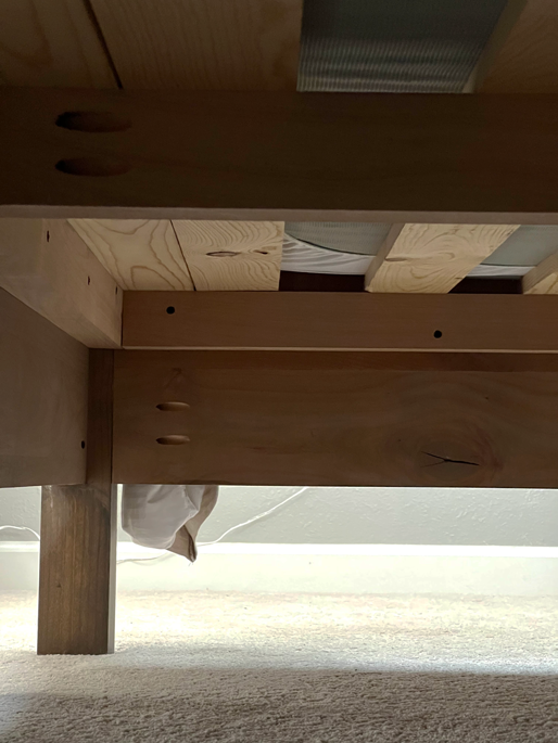 DIY canopy frame under the bed view with cleats and slats supporting the mattress