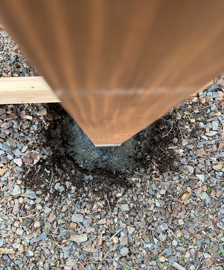 Easy DIY garden arbor post set in a hole with concrete. 