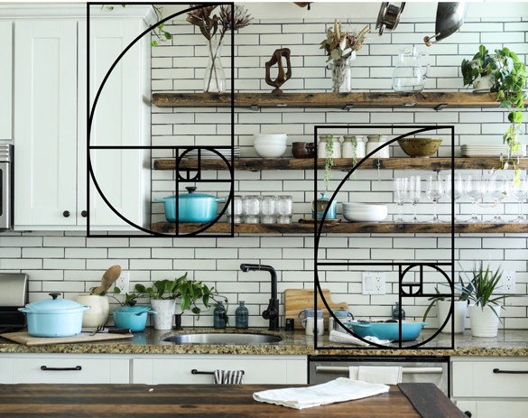 A neutral white kitchen with wood open shelving and white subway tile showcases color use in the golden ratio. Most of the scene is in neutrals and whites, 30% of the scene shows wood tones as contrast. Ten percent of the scene shows a pop of blue color in the cookware. An overlay of the golden spiral showcases how placement of items and color within the grid creates balance and proportion. 